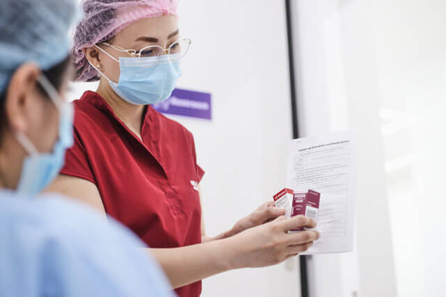Doctor holding eye medicines for the patient